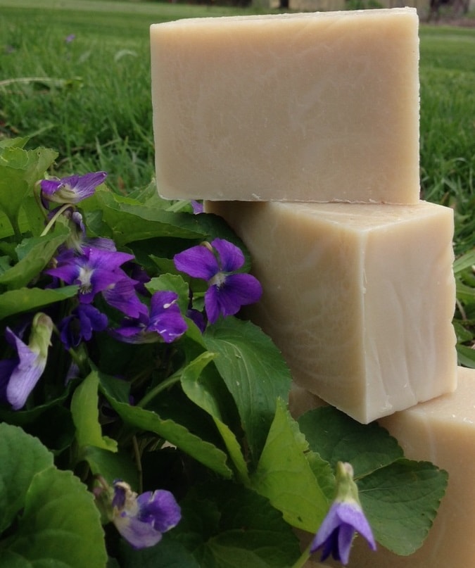 Handmade herbal soap bars with purple flowers